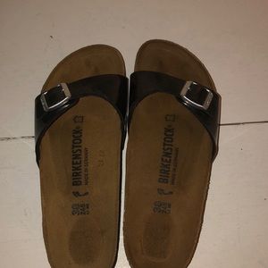 Black Birkenstocks one strap.